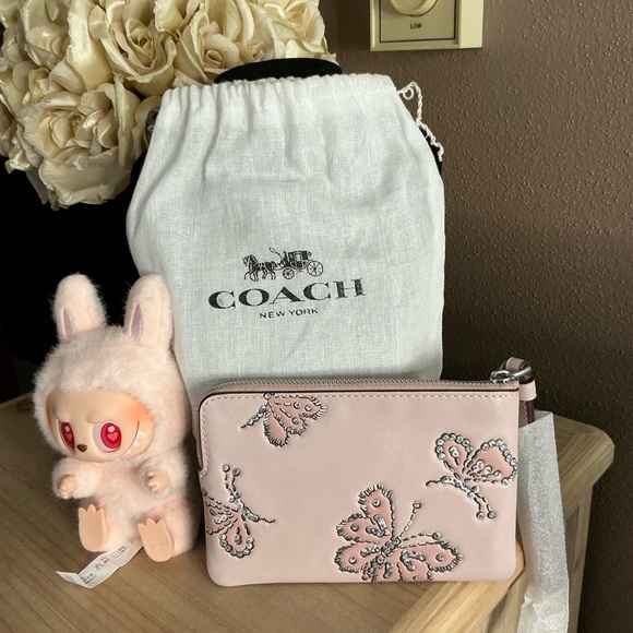 Coach Handbags - Coach Blush Butterfly Rivets Corner Zip Wristlet plus a Pop Mart lil’ Monster
